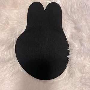 Black self adhesive bra. Tag size XXXL, which really equals a US size 38-40D.